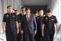 Former Armed Forces Chief Tan Sri Mohd Nizam Jaafar arrives at the Sessions Court this morning to face four charges, including abuse of power and criminal breach of trust. Photo by Rosli Talib