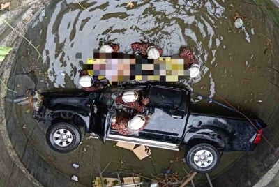 A man was killed while his companion suffered a fractured arm after the four-wheel-drive vehicle they were travelling in skidded off the road and plunged into a drainage hole along Jalan Pantai here on Friday.