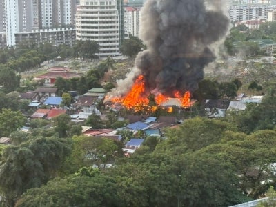 Three squatter houses were completely destroyed in a fire this morning at Jalan Kwangyi, Kampung Bellamy, near the Nirvana Cemetery grounds here. Photo: Social media