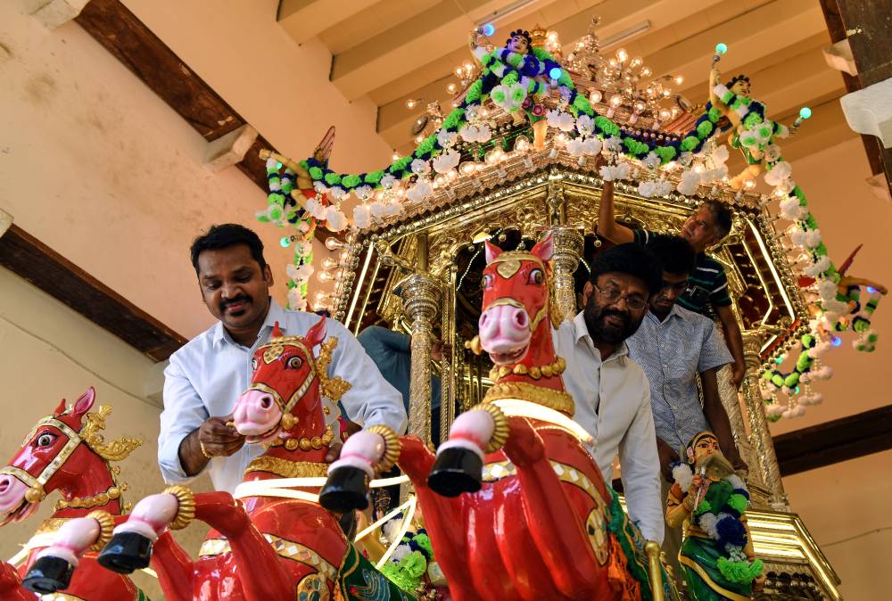 Penang Nattukotai Chettiar Temple Trust Manager, PRC Veerappan (left) with volunteers decorating a 132-year-old chariot in preparation for the Thaipusam festival on Feb 1. Photo by Bernama