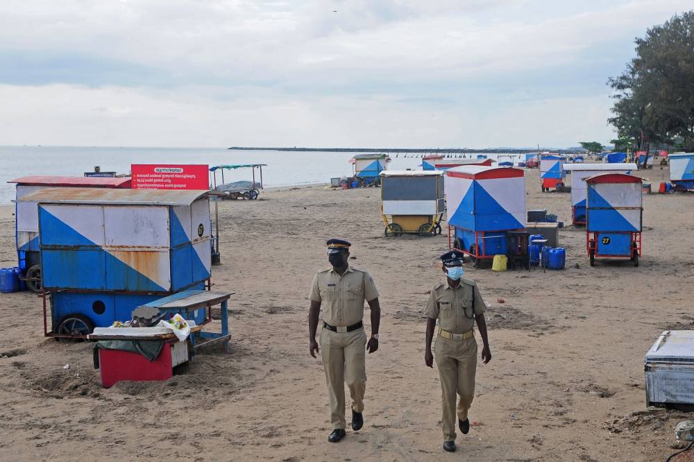 Security personnel patrol near a deserted Kozhikode beach after restrictions were imposed by the district administration in Kozhikode, in India's southern state of Kerala on September 18, 2023. (AFP file photo)