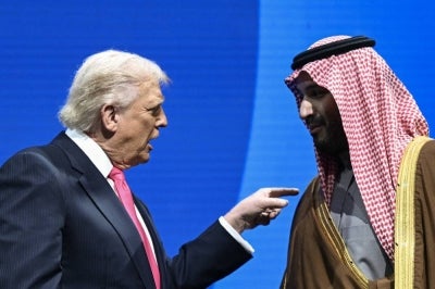 Crown Prince and Prime Minister of the Kingdom of Saudi Arabia Mohammed bin Salman and US President Donald Trump speaks at the US-Saudi Investment Forum at the John F. Kennedy Center for the Performing Arts in Washington, DC on November 19, 2025. (Photo by Brendan SMIALOWSKI / AFP)