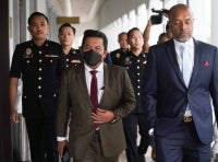Former military intelligence chief Lieutenant-General Datuk Mohd Razali Alias pleaded not guilty at the Kuala Lumpur Sessions Court on Thursday to three charges of receiving bribes amounting to ASD20,000 and two international flight tickets in 2024 and last year. - Sinar/Rosli Talib