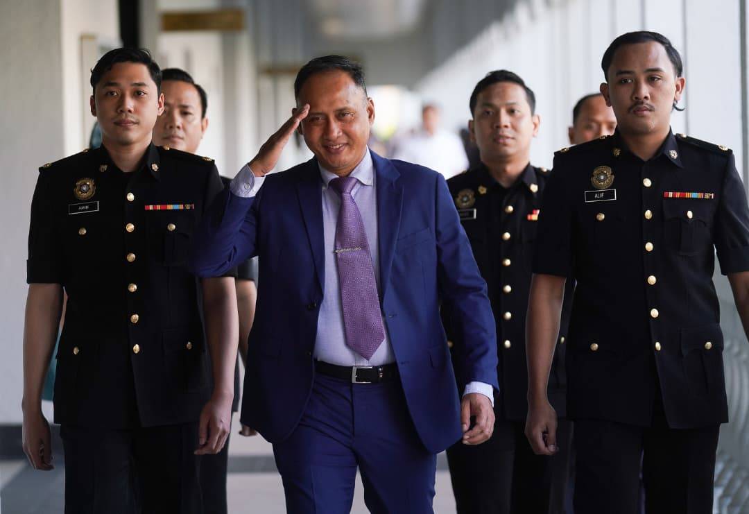 The 56-year-old was seen walking into the court complex flanked by Malaysian Anti-Corruption Commission (MACC) officers, drawing the attention of photographers and reporters who had gathered as early as 7am. - Sinar photo