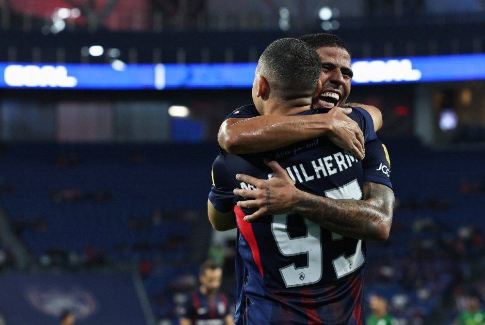 JDT player Bergson Gustavo Silveira Da Silva (back) celebrates a goal with teammate Marcos Guilherme De Almeida Santos Matos (front) during their Super League match against Imigresen FC at Sultan Ibrahim Stadium. Photo by Bernama