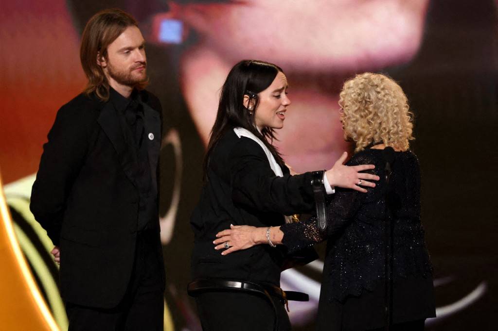 Finneas O'Connell and Billie Eilish accept the Song Of The Year award for “Wildflower” onstage. Photo by Kevin Winter/Getty Images via AFP