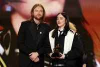 Finneas O'Connell and Billie Eilish accept the Song Of The Year award for “Wildflower” onstage. Photo by Kevin Winter/Getty Images via AFP