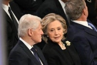 Former US President Bill Clinton and former Secretary of State Hillary Clinton speak as they attend the State Funeral Service for former US President Jimmy Carter at the Washington National Cathedral in Washington, DC, on Jan 9, 2025. - (Photo by MANDEL NGAN / AFP)