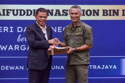 Saifuddin and Shuhaily during the Home Minister’s 2026 Engagement Session and Address with AKPS personnel at the Setia Perkasa Complex today. - Bernama photo