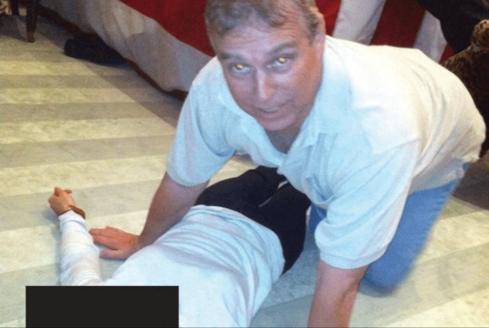 This undated photo at an undisclosed location released by the US Justice Department on Jan 30, 2026 as part of the Jeffrey Epstein files shows British former prince Andrew Mountbatten-Windsor kneeling over a woman lying on the floor. Photo by Handout/US DOJ/AFP