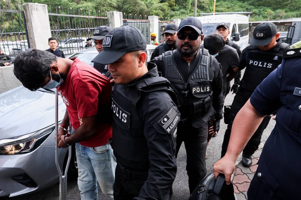 R. Arasan, 32, and R. Utes, 36, nodded in acknowledgment after the charges were read out before Magistrate Nabilah Nizam. - Bernama photo