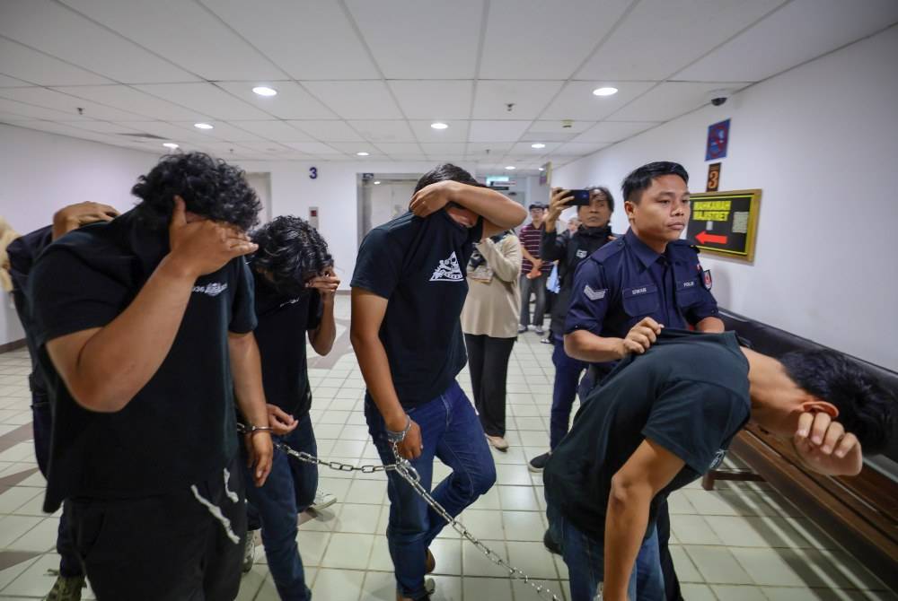 A total of 12 Selangor FC supporters were charged at two Magistrate's Courts today on charges of possessing and testing positive for drugs, on Monday. - Photo by Bernama