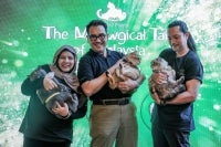 bzBee Consult founder and managing director Prof Mohd Said Bani CM Din with his cats during the launch of ‘A Book of Poems: The Meowgical Tails of Malaysia’ at the Lumi Marketplace. - Photo by Bernama