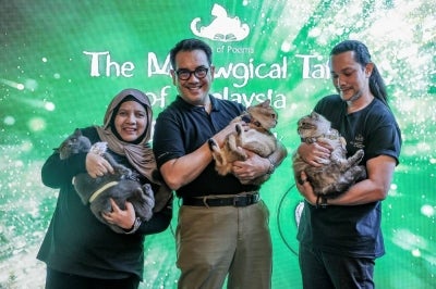 bzBee Consult founder and managing director Prof Mohd Said Bani CM Din with his cats during the launch of ‘A Book of Poems: The Meowgical Tails of Malaysia’ at the Lumi Marketplace. - Photo by Bernama