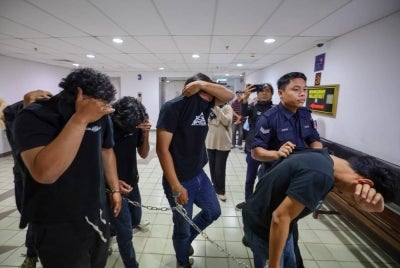 A total of 12 Selangor FC supporters were charged at two Magistrate's Courts today on charges of possessing and testing positive for drugs, on Monday. - Photo by Bernama