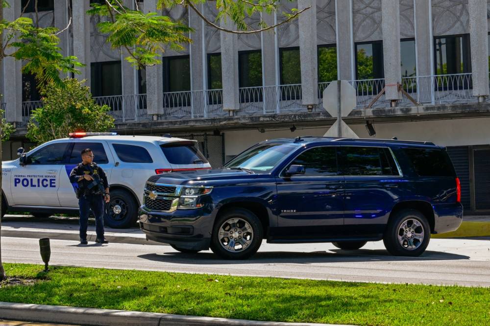 A motorcade believed to be carrying Ryan Wesley Routh, suspected of the attempted assassination of former US president Donald Trump, departs the Paul G. Rogers Federal Building and US Courthouse following Routh's detention hearing in West Palm Beach, Florida, on September 30, 2024. Ryan Wesley Routh, 58, was charged with possession of a firearm as a convicted felon and possession of a firearm with an obliterated serial number at his initial court appearance. (Photo by Giorgio VIERA / AFP)