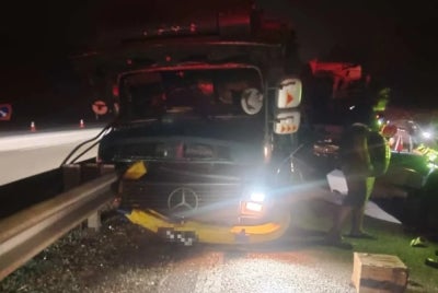 The Scania express bus is owned by Inter Top while the 10-tonne bonded lorry belongs to Securiforce. - Photo courtesy of JBPM