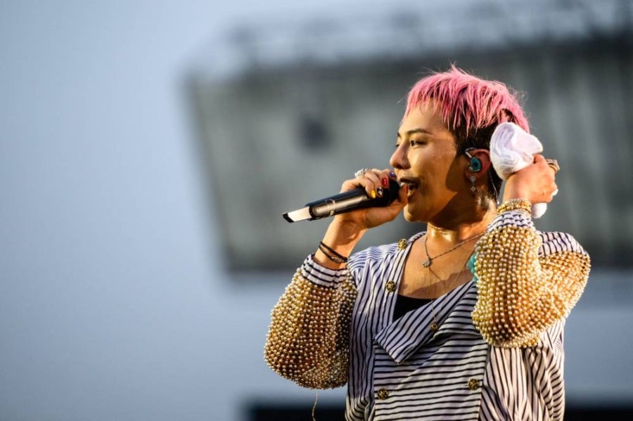 G-Dragon, a member of K-pop group BigBang, performs as a guest during South Korean rapper PSY’s ‘Summer Swag 2025’ opening tour concert at the Incheon Asiad Main Stadium in Incheon on June 28, 2025. - (Photo by ANTHONY WALLACE / AFP)