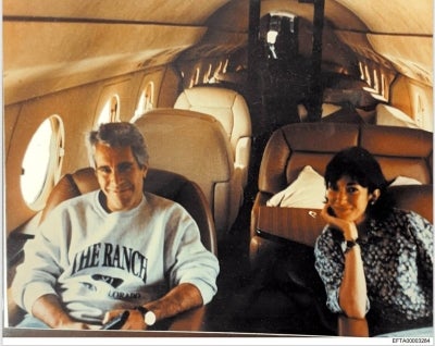 This undated photo provided by the US Justice Department on December 19, 2025 shows Jeffrey Epstein, a wealthy US financier who died in jail in 2019 while awaiting trial for sex trafficking underage girls, and his associate, Ghislaine Maxwell aboard a jet. The Epstein Files Transparency Act (EFTA) passed by Congress and signed into law by US President Donald Trump mandated the complete release of the Epstein files by December 19, 2025. (Photo by Handout / US DEPARTMENT OF JUSTICE / AFP) 