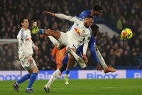 Leeds United's German striker Lukas Nmecha (C) vies with Chelsea's Ecuadorian midfielder Moises Caicedo (R) and Chelsea's English defender Josh-Kofi Acheampong (2R) during the English Premier League football match between Chelsea and Leeds United at Stamford Bridge in London on February 10, 2026. (Photo by Adrian Dennis / AFP)