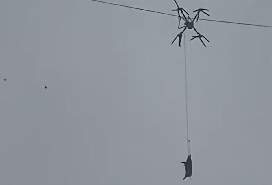 A farmer in southwestern China caused a 10-hour power outage in his village after using a drone to transport pigs, only for one of the animals to become suspended mid-air when the drone’s rope snagged a power line. Photo: X