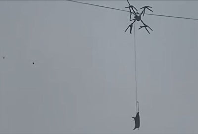 A farmer in southwestern China caused a 10-hour power outage in his village after using a drone to transport pigs, only for one of the animals to become suspended mid-air when the drone’s rope snagged a power line. Photo: X