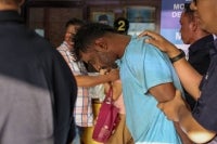 Plumber L. Ravinder, 40, was was charged at the Magistrate’s Court today with the murder of a woman, believed to be his girlfriend, at a house earlier this month. - Photo by Bernama