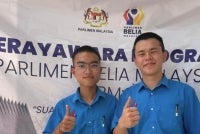 PLKN trainees Teh Yih Khye (left) and Liang Calvin when met at the 505th Territorial Army Regiment, Force Camp, in Pekan, Pahang. - Bernama photo