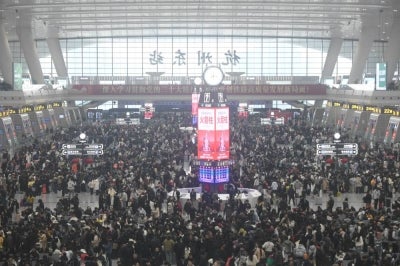 People crowd a railway station in Hangzhou, in China’s eastern Zhejiang province on February 13, 2026, ahead of Lunar New Year celebrations. Millions across China are returning to their hometowns to celebrate the beginning of the Year of the Horse on February 17. (Photo by CN-STR/AFP)