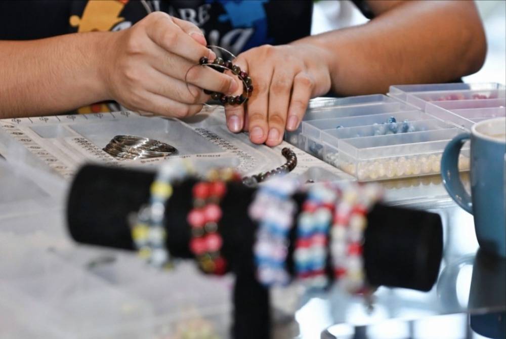 A table set up in a hotel lobby may look like an ordinary retail counter. But for the youths standing behind it, it represents something far greater, a doorway to independence. Photo: Sheraton Imperial Kuala Lumpur Hotel