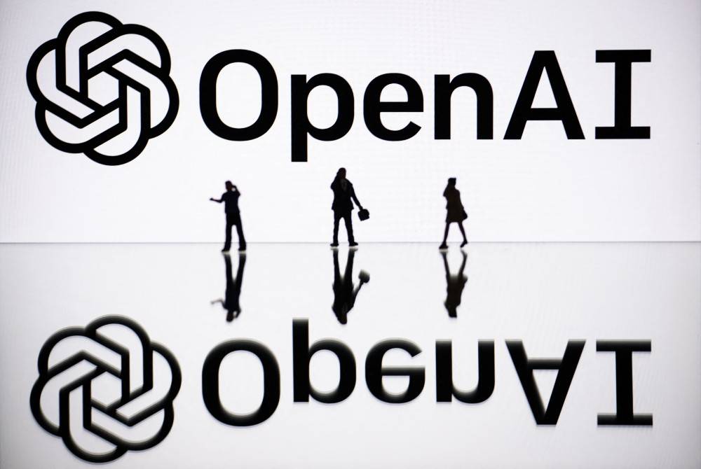 This illustration photograph taken on Oct 30, 2023, in Mulhouse, eastern France, shows figurines next to a screen displaying a logo of OpenAI, a US artificial intelligence organisation. - (Photo by SEBASTIEN BOZON / AFP)