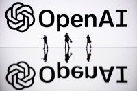 This illustration photograph taken on Oct 30, 2023, in Mulhouse, eastern France, shows figurines next to a screen displaying a logo of OpenAI, a US artificial intelligence organisation. - (Photo by SEBASTIEN BOZON / AFP)