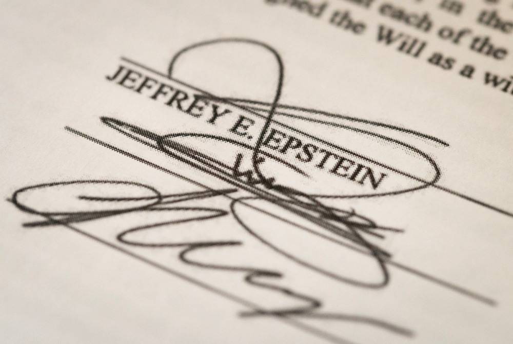 In this photo illustration, Jeffrey Epstein's signature on a will, part of the Epstein files released by the Department of Justice, is shown on Feb 13, 2026 in Chicago, Illinois. - (Photo by SCOTT OLSON / Getty Images via AFP)