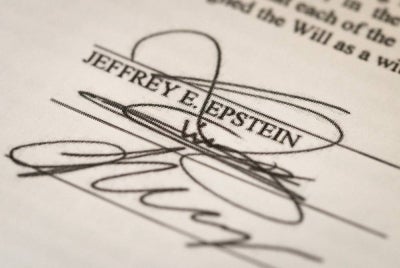 In this photo illustration, Jeffrey Epstein's signature on a will, part of the Epstein files released by the Department of Justice, is shown on Feb 13, 2026 in Chicago, Illinois. - (Photo by SCOTT OLSON / Getty Images via AFP)