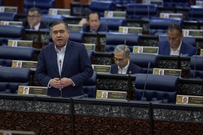 Transport Minister Anthony Loke during a question-and-answer session at the Dewan Negara, today. - Photo by Bernama