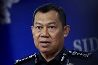 Johor police chief Datuk Ab Rahaman Arsad during a press conference, today, on the abuse of the image and voice of State Women, Family and Community Development Committee chairman Khairin-Nisa Ismail@Md On in a suspected scam. - Photo by Bernama