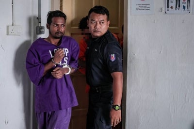 A Rohingya man was charged in the Magistrate's Court on two charges including murdering his pregnant wife on Feb 13. Photo by Bernama