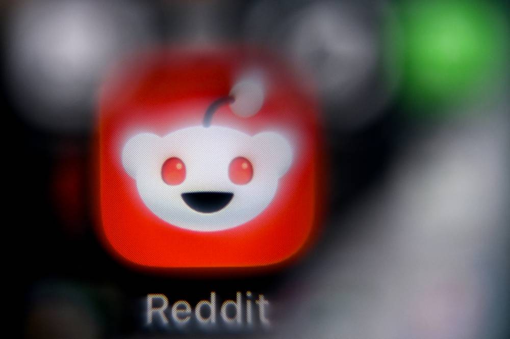 Picture taken in Frankfurt am Main, western Germany, on January 22, 2026, shows the logo of US social news aggregations Reddit on a smartphone screen. (Photo by Kirill KUDRYAVTSEV / AFP)