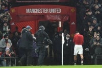 Manchester United's English midfielder #61 Shea Lacey walks down the tunnel having been sent off during the English FA Cup third round football match between Manchester United and Brighton and Hove Albion at Old Trafford Stadium in Manchester, north west England, on January 11, 2026. (Photo by PETER POWELL/AFP)