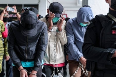 MAF officers - Major Mohd Azmi Abu Bakar, 40, Warrant Officer Mohd Norbuang Ghani, 41, and Captain Muhammad Bahaudin Abd Rashid, 30, were charged with causing the death of UTM officer cadet Syamsul Haris Shamsudin. - Photo by Bernama