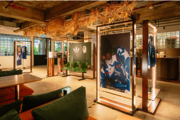 The collection is headlined by two standout jerseys. The first is a long-sleeved, collared fan top featuring a denim-inspired print, complete with BAPESTA and co-branded detailing.