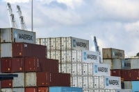 Shipping containers of the Danish company Maersk are stored at the port of Balboa in Panama City, taken on February 12, 2026. Hong Kong-based conglomerate CK Hutchison warned on February 12 of possible legal action against Danish firm Maersk and others over the annulment of its contract to operate two ports on the Panama Canal. (Photo by MARTIN BERNETTI / AFP)