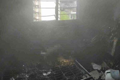 The child's charred body was found after firefighting efforts were carried out on the 10th floor of the residential block.