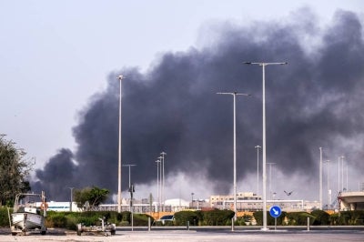 A plume of smoke rises from the Zayed Port following a reported Iranian strike in Abu Dhabi on March 1, 2026. Iran's retaliatory missile and drone campaign in the Gulf has killed three people and wounded 58 in the United Arab Emirates since it began, Emirati authorities said on March 1, the day after the US and Israel launched a nationwaide attack on Iran killing its supreme leader. (Photo by Ryan Lim / AFP)