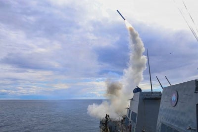 This US Navy photo released by US Central Command public affairs shows Arleigh Burke-class guided-missile destroyer USS Thomas Hudner (DDG 116) firing a Tomahawk land attack missile in support of Operation Epic Fury, from an undisclosed location on March 1, 2026. - (Photo by US Central Command (CENTCOM) / AFP)