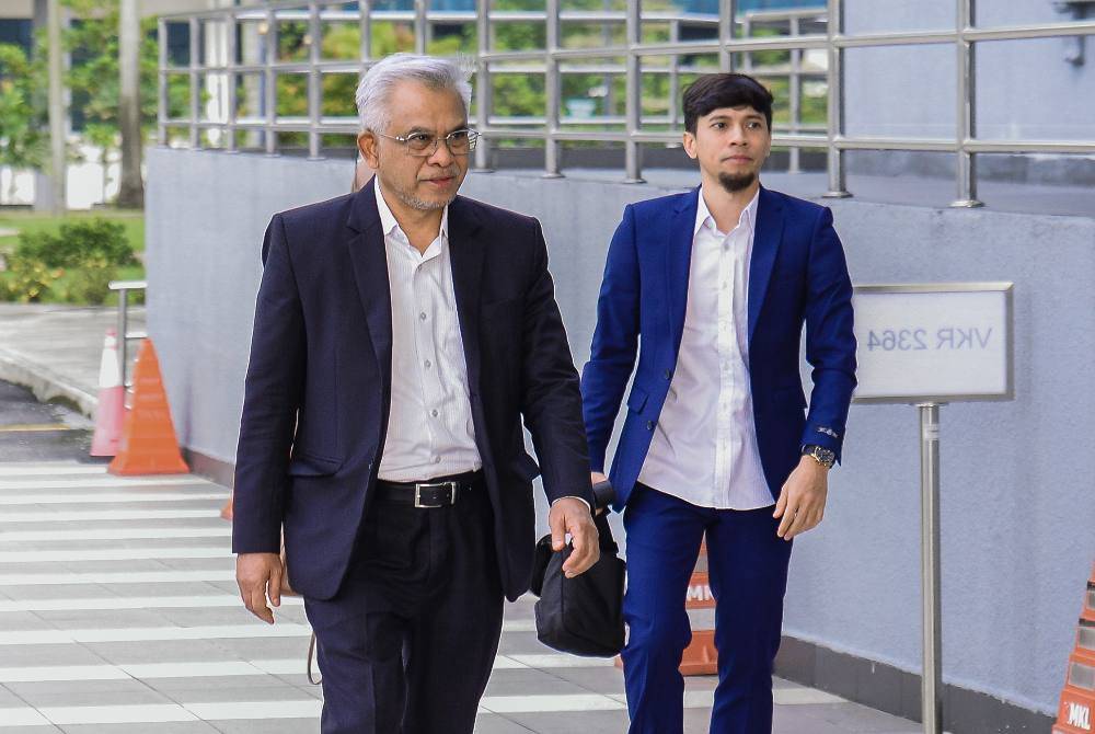 Two company directors, including a prominent Islamic finance figure, were charged in the Sessions Court here today on seven charges of criminal breach of trust (CBT) involving RM10.55 million. Photo by Bernama