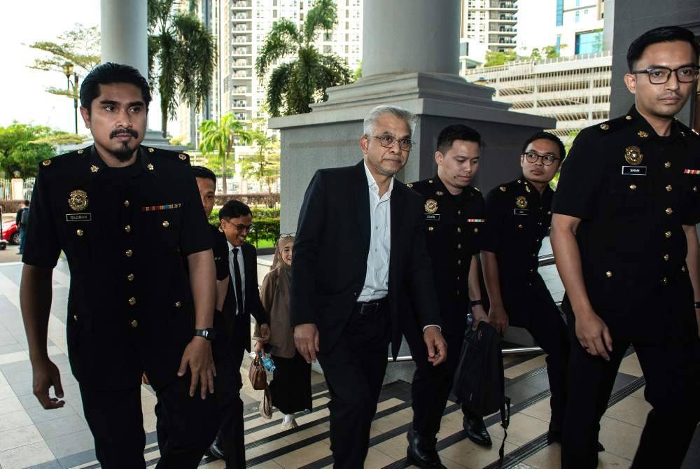 Two company directors, including a prominent Islamic finance figure, were charged in the Sessions Court here today on seven charges of criminal breach of trust (CBT) involving RM10.55 million. Photo by Bernama