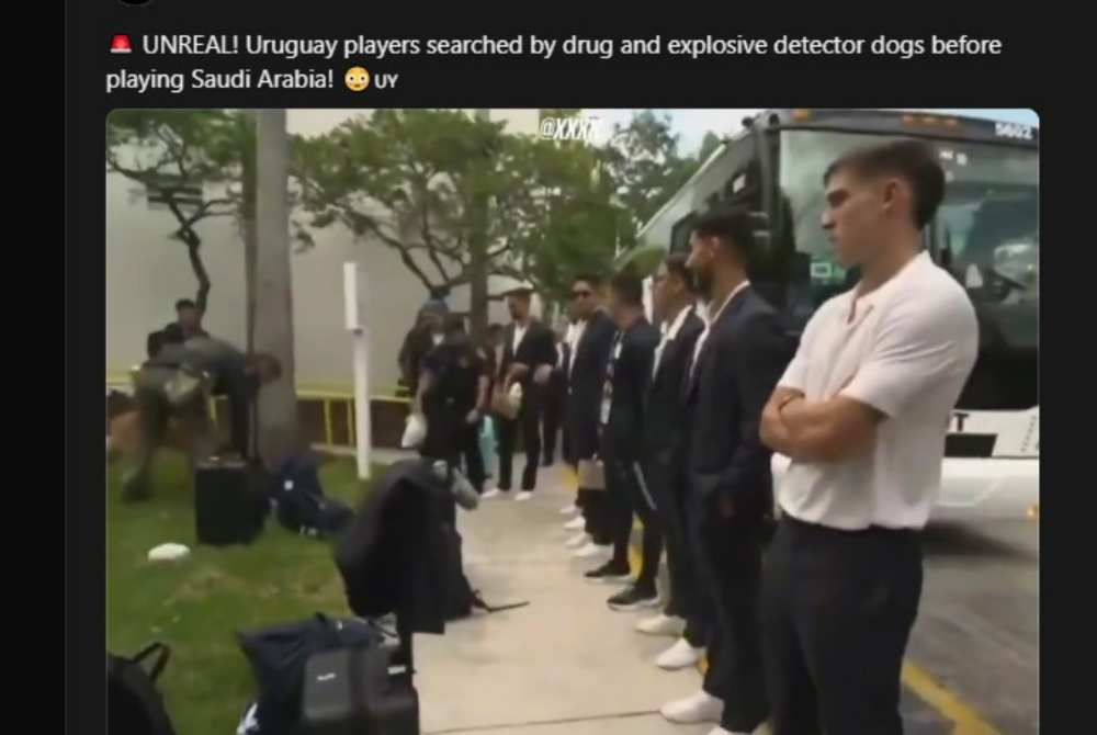 Screenshot of video footage showing clip captured members of the Uruguayan squad waiting beside their team bus while officials carried out security screenings on suitcases lined up along the roadside. - Thread/ @cupidfc