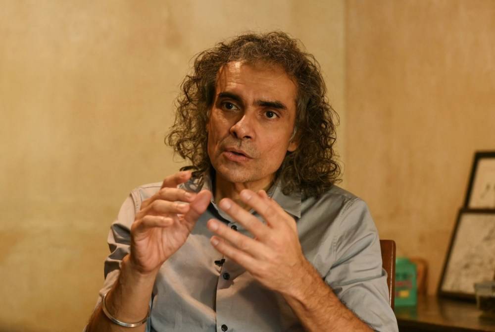 This photograph taken on May 27, 2026 shows Bollywood filmmaker Imtiaz Ali speaking about his upcoming film 'Main Vaapas Aaunga' during an interview with AFP in Mumbai. - (Photo by Indranil Mukherjee / AFP)