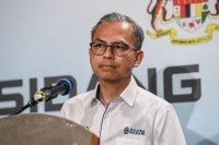 The government is looking to expand its medicine delivery programme nationwide, with patients no longer required to bear postal delivery costs, says Communications Minister Datuk Fahmi Fadzil. - Photo by Bernama